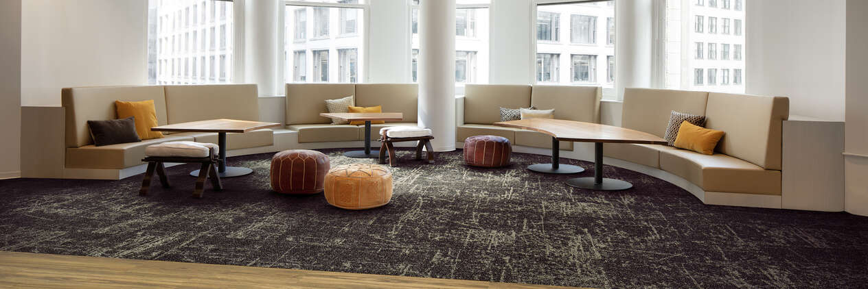 Seating area with dark gray Interface carpet tile.