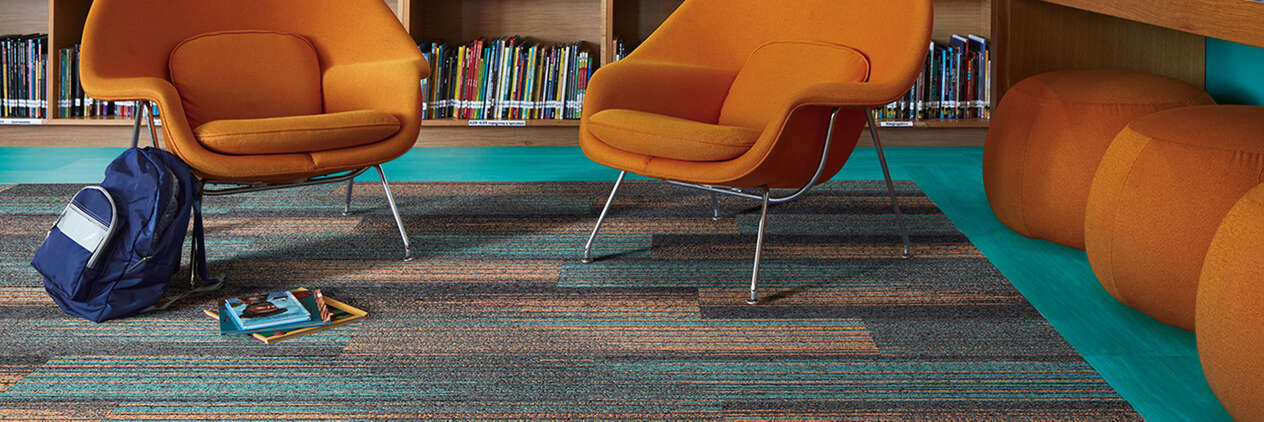 Colorful Interface carpet tile with orange chairs